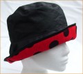 Black Wax Hat with Black Spots on Red Brim